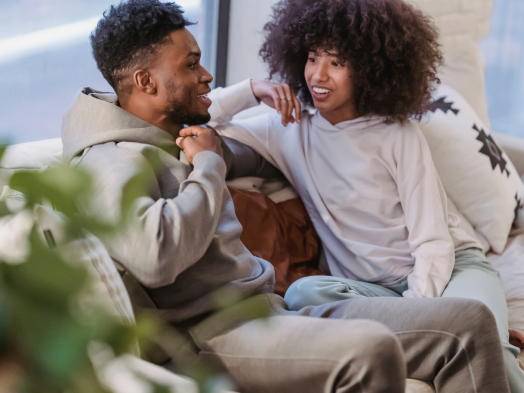 Couple sitting together and talking during a supportive moment while exploring same-day couples rehab options on Long Island