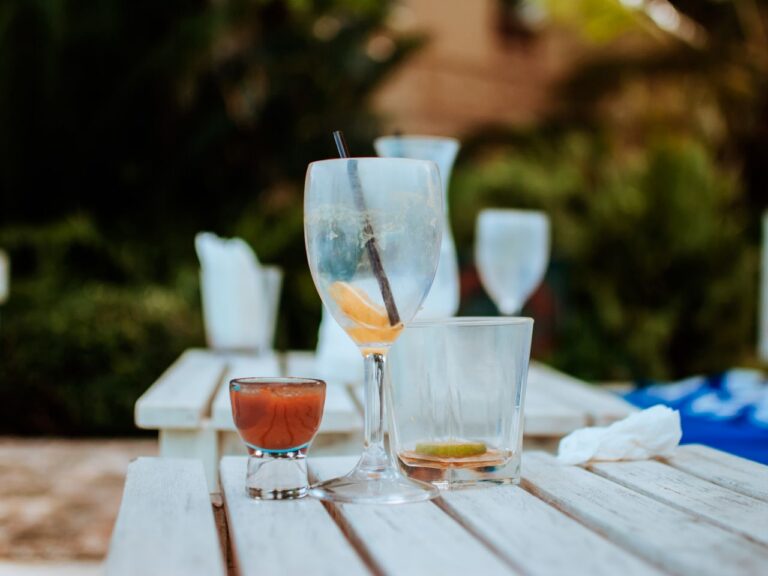 empty glasses on a white wooden table